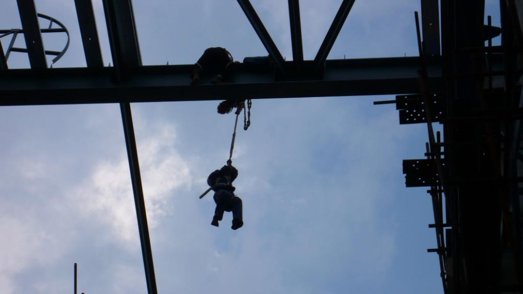 Colleagues bringing their co-worker back to safety