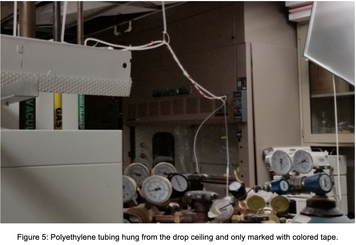 Figure 5 Polyethylene tubing hung from the drop ceiling and only marked with colored tape