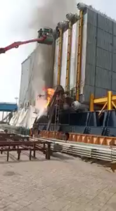 Hot Work Fire Over Plastic Tarp With Workers on a Lift