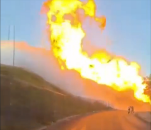LPG Tanker Truck Catastrophic Failure-Ignition viewed from lower road